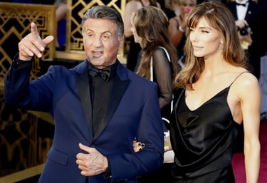 sylvester stallone in blue suit with wife