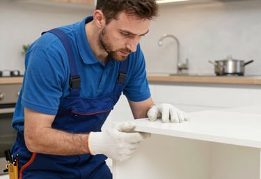 A skilled handyman fixing a door lock in a modern office space.