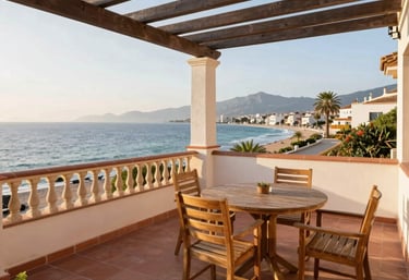 A beautifully designed outdoor terrace with comfortable seating and lush greenery under a clear blue sky.