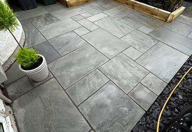 Blackpool garden paved with different sized flagging