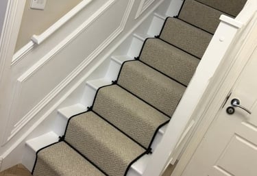 Blackpool carpet fitted on white wooden stairs