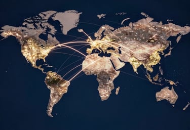 A conceptual photograph of global network connectivity represented by light trails connecting major world cities on a dark blue background.