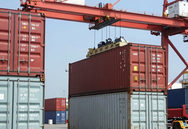 Workers from the cooperative loading cargo containers onto a ship at a busy Costa Rican port.