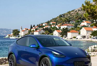 Elegant black luxury car parked in a sleek urban setting at dusk.