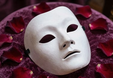 A close-up of a dramatic theatre mask lying on a velvet cushion, surrounded by rose petals in shades of deep mauve and dark plum, elegant photography style.