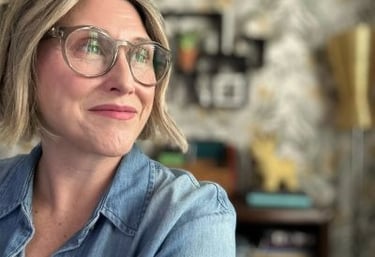 Career coach, PJ, in her office gazing over left shoulder