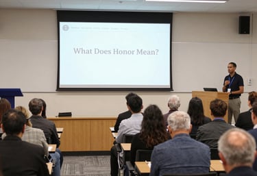 A dedicated professional leading a seminar with attentive participants in a community meeting room.