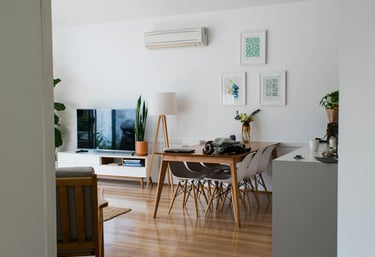 A wall ac unit cooling off a room . 