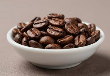 Detailed macro photograph of premium light-roasted coffee beans in a refined ceramic dish. Set against a muted taupe background with clean, professional studio lighting.