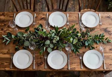 A top-down shot of a North American farm-to-table dinner party, featuring earthy brown wooden tables and forest green foliage.