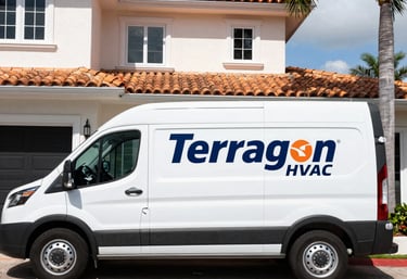 A skilled HVAC technician carefully installing a sleek air conditioning unit in a modern South Florida home.