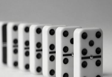 a man riding a skateboard down a street next to tall buildings