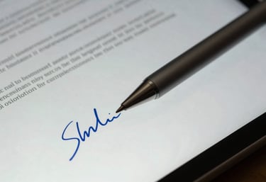 Macro shot of a digital tablet pen resting on a sleek screen, symbolising modern digital signatures and paperwork, cool blue and off-white tones.