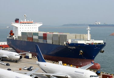 A busy warehouse with organized shelves and workers handling packages efficiently.