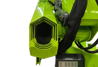 Close-up of green machine with attached hose, featuring hexagonal structure.