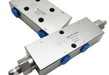 Two stainless steel valves with blue handles, secured by a safety valve lock, guaranteeing superior safety by locking the oil