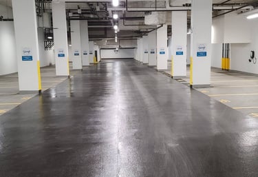 A basement parking lot with a fresh coating applied.