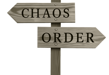 Rustic wooden signpost with arrows pointing to Chaos and Order