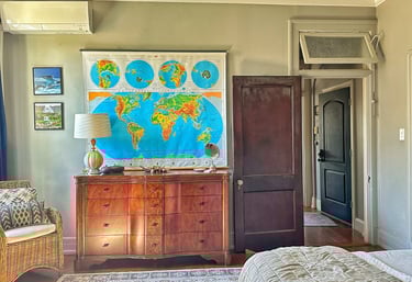 map of world in bedroom of 2123 rivermont apartments