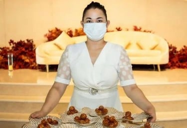 a woman in a white dress and mask covering her face with a mask covering her