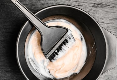 Hair color mixed in a  bowl and brush  Hair color services image  in Brookfield IL