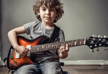 a young boy playing guitar in a studio