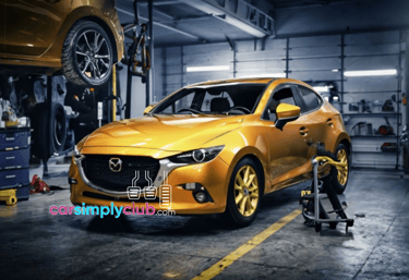 a mazda car in a garage with a man working on a car