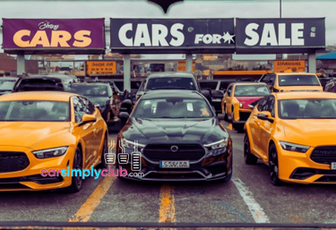 a car dealership with a lot of cars parked in front of a store