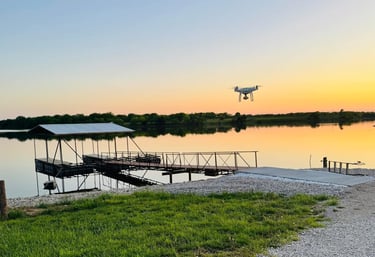 a drone flying over a body of water