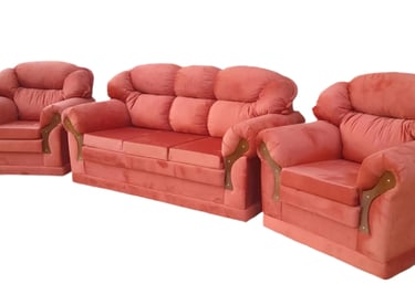 a set of three couches with a red couch