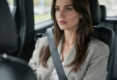 A serene executive sitting comfortably in the backseat of a car, eyes closed, relaxed.