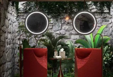 a bathroom with a red chair and a mirror