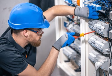 a man in a blue helmet, an electrician