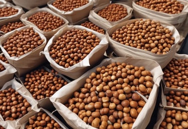 A cardboard container holds a serving of food, including cooked potatoes with herbs, slices of pickles, a dollop of creamy sauce, and a portion of red cabbage. The food is being held by a hand.
