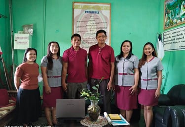 a group of people standing in front of a laptop