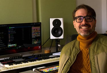 a man in a jacket and glasses is smiling