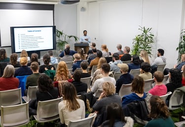 A design professional delivering a talk at a design conference