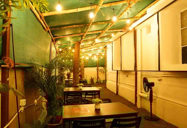 a restaurant with a table and chairs in the garden area