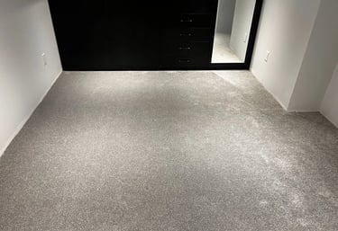 Grey carpet installed wall-to-wall in warm and soft basement space in Tillsonburg Ontario residential home