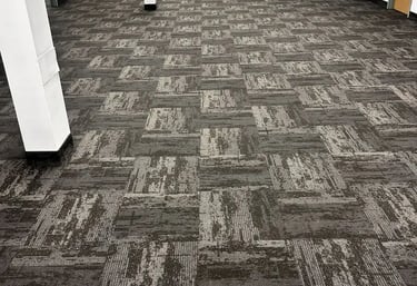Dark grey design commercial carpet tile installed in conference room, London downtown office