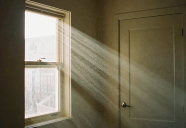 Natural sunlight streaming through a window showing potentially harmful indoor air toxins