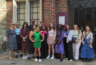 a group of people standing in front of a King's Chapel of Savoy