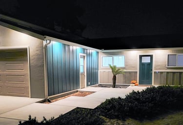 exterior home renovation. custom concrete walk way, new side paneling, windows and custom paint. Colorado Springs remodel.