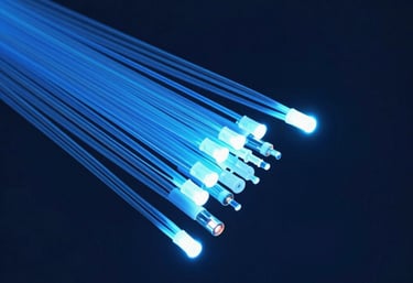 Macro view of glowing blue fiber optic cables, representing high-speed connectivity and modern technical support, against a dark navy background.