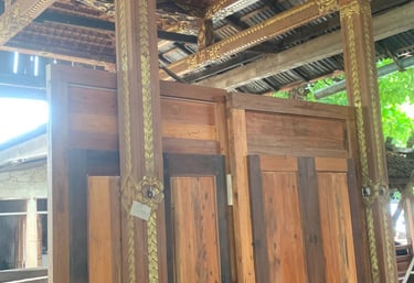 Detailed antique teak wood carving on Joglo structure showing heritage craftsmanship and cultural design elements