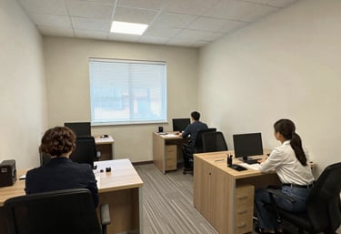 A warm, inviting real estate office with agents happily assisting clients.