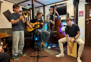 An image of Jamie Walker performing on his Double Bass with a quartet