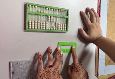 Image of two hands feelingtactile elements of study material for visually impaired