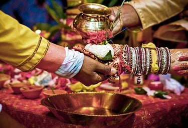 Pandit ji performing puja at the time of phere in hindu marriage