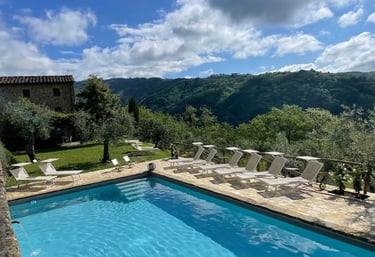 view of tuscany and pool where people will stay on a retreat
